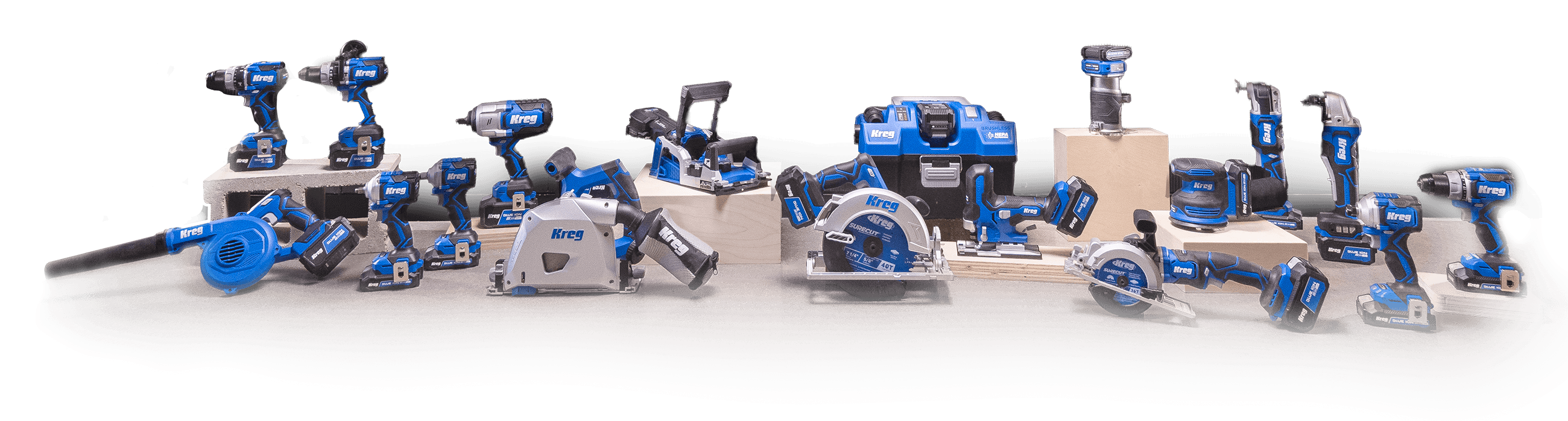 Image of all Ionic Drive tools from Kreg in a layout on wooden boxes