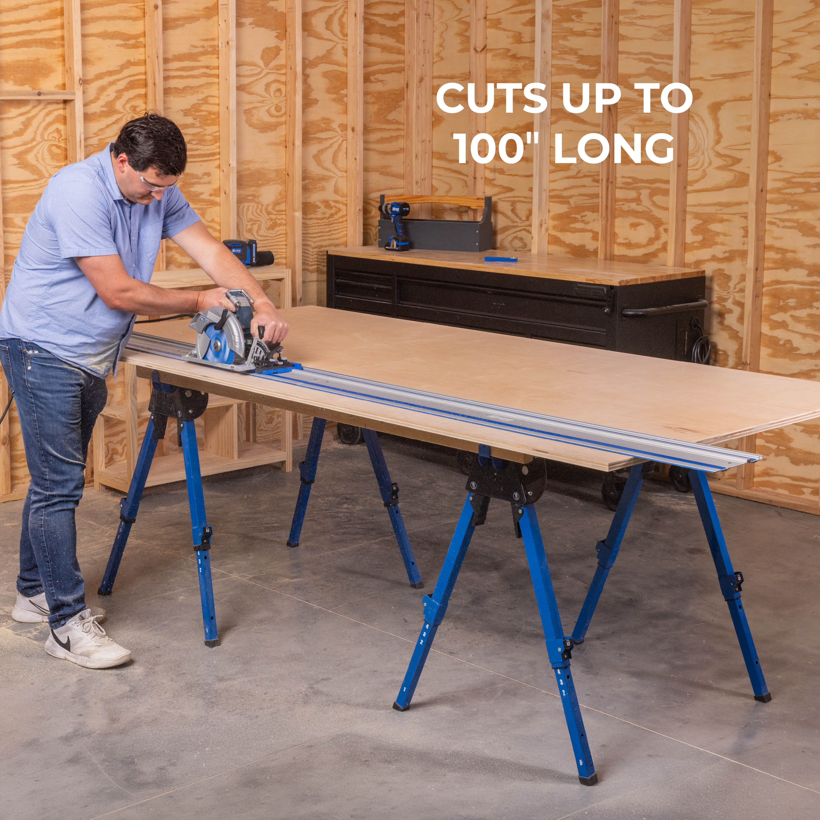 A man cuts a sheet of plywood with his circular saw on the Kreg Universal Track. A callout mentions that the track's capacity cuts up to 100" long. 