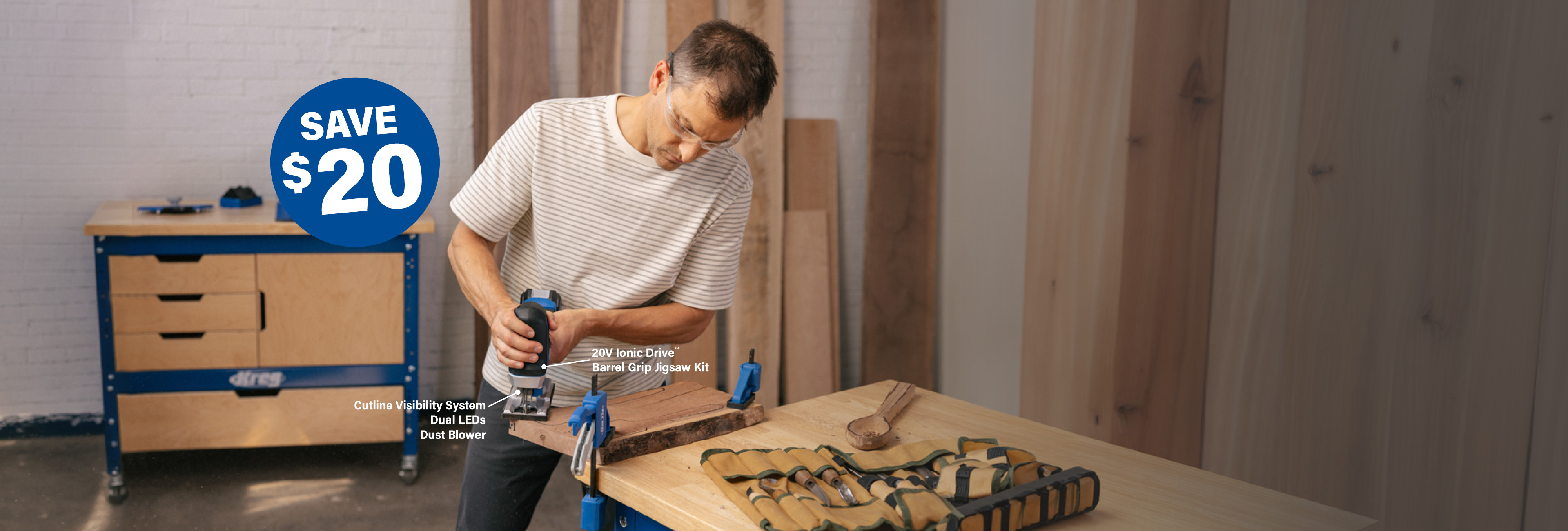 A man uses a jigsaw to cut out a slab of wood on his workbench, using the Kreg Ionic Drive Jigsaw. A burst calls out $20 savings on the tool.