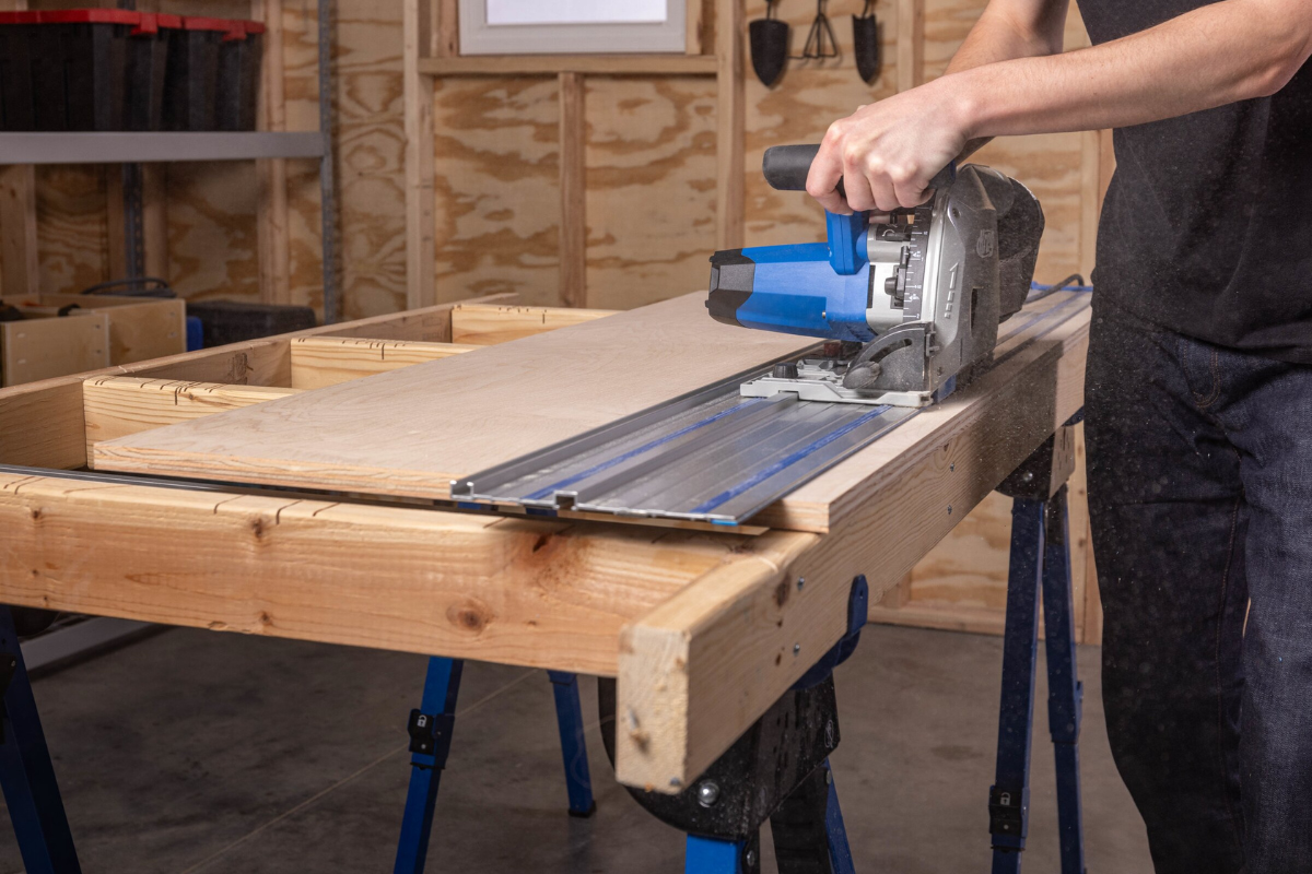 Image of a man using a track saw
