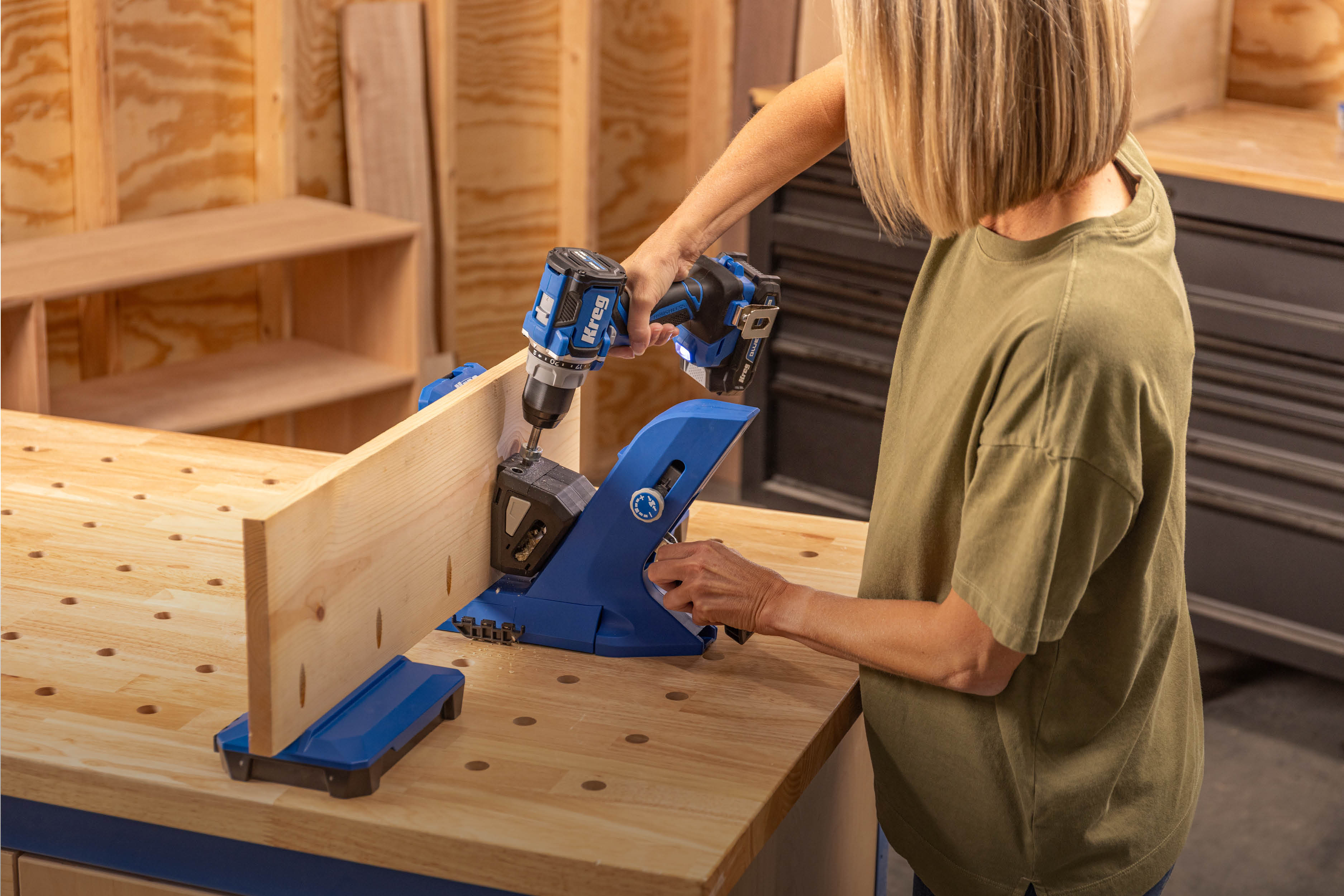Image of a woman using a KPHJ720PRO with a Kreg Drill